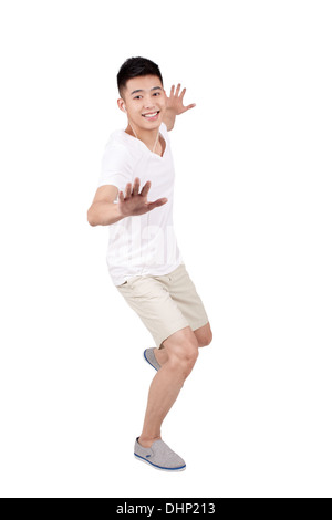Studio shot Young casual man using laptop Stock Photo - Alamy