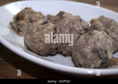a tasty Italian recipe: meatballs of meat with mushrooms Stock Photo