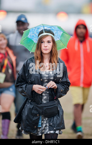 The Reading Festival - girl in an umbrella hat UK 2013 Stock Photo