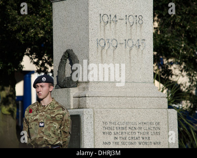Young boy soldier standing next to a war memorial UK Stock Photo