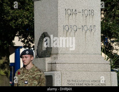 Young boy soldier standing next to a war memorial UK Stock Photo