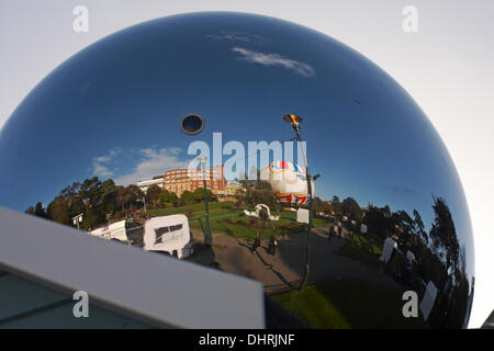 Bournemouth, UK 14 November 2013. Bournemouth prepares for Christmas - sphere reflects and magically inverts to create an upturned living image of the surroundings in the Lower Gardens. Credit:  Carolyn Jenkins/Alamy Live News Stock Photo