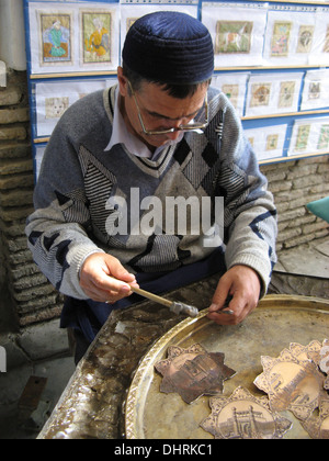 Traditional man making jewelry in Samarkand, Uzbekistan Stock Photo