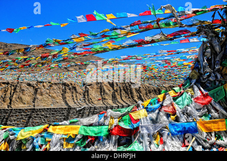 Prayer flags on the road in Tibet Stock Photo