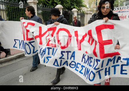 Athens, Greece. 14th November 2013. Protesters hold banners and shout slogans against the Greek government, as they march in protest of the public television, ERT's shut down and the, more than 4,000, upcoming layoffs ordered by Greece's lenders. Credit:  Nikolas Georgiou / Alamy Live News Stock Photo