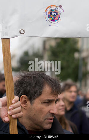Athens, Greece. 14th November 2013. Protesters hold banners and shout slogans against the Greek government, as they march in protest of the public television, ERT's shut down and the, more than 4,000, upcoming layoffs ordered by Greece's lenders. Credit:  Nikolas Georgiou / Alamy Live News Stock Photo