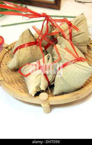 The Picture Dessert wrapped in banana leaves and Originating from China. Stock Photo