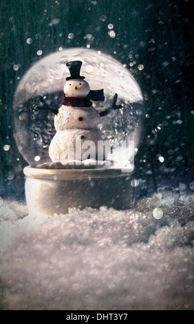 Snow globe in a snowy winter setting Stock Photo