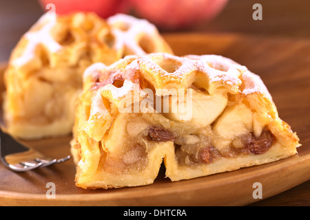 Apple strudel with raisins (Selective Focus, Focus on the left side of the apple-raisin stuffing) Stock Photo