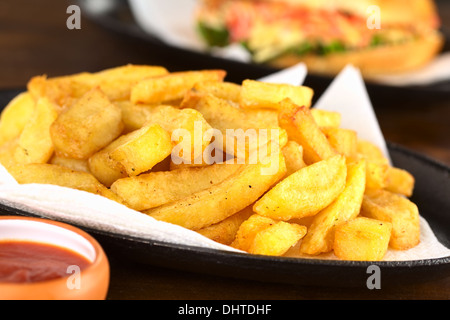 French fries with ketchup (Selective Focus, Focus one third into the fries) Stock Photo