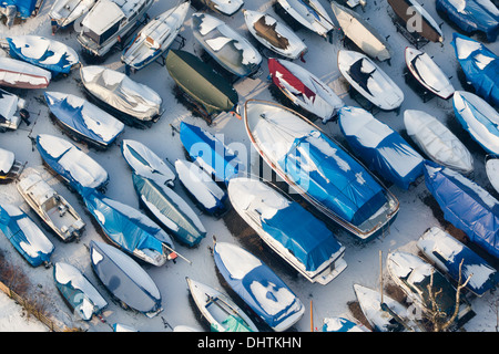 Netherlands, Loenen aan de Vecht, Small yachts at camping site. Winter. Aerial Stock Photo