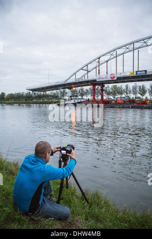 Netherlands, Weesp, Replacement of bridge on canal called Amsterdam-Rijnkanaal. Photographer Frans Lemmens takes picture. Stock Photo