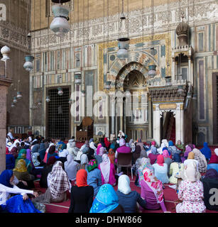 Cairo, Egypt . 15th Nov, 2013. Muslims, mainly women listen to sermon given by a woman, before Friday prayers in the Mamluk mosque of Sultan Hasan. Stock Photo