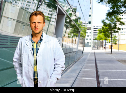 Young Scientist or doctor with confident personality standing in urban area Stock Photo