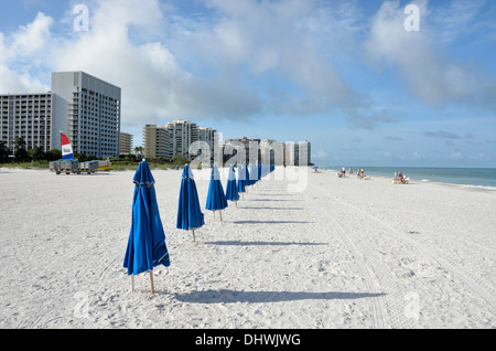 Row of closed umbrellas on Marco Island Beach by the Hilton Hotel, Marco Island, Florida Stock Photo