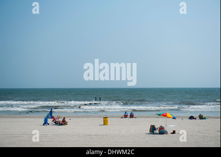 USA America New Jersey NJ N.J. Atlantic City people on the beach sunbathing and enjoying the surf Stock Photo