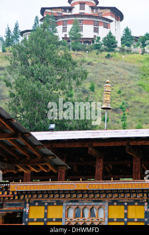 Paro,main street,traditional architecture,richly decorated buildings housing small shops surrounded by farms rice paddies,Bhutan Stock Photo