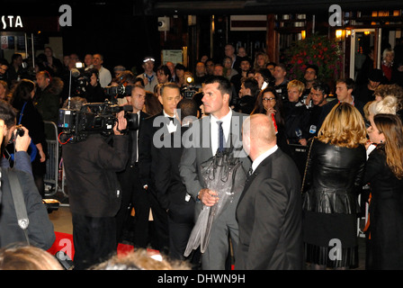 Media scrum at the Gala Premiere of Captain Phillips, with Tom Hanks being interviewed Stock Photo