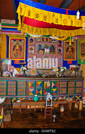 Buddhist prayer room incorporated into a Farm house,where animals live on the ground floor,inhabitants on the second,Paro,Bhutan Stock Photo