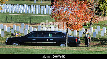 The car carrying United States President Barack Obama passes in front of a saluting veteran at Arlington National Cemetery in Arlington, Virginia, USA, November 11, 2013. Credit: Olivier Douliery / Pool via CNP Stock Photo