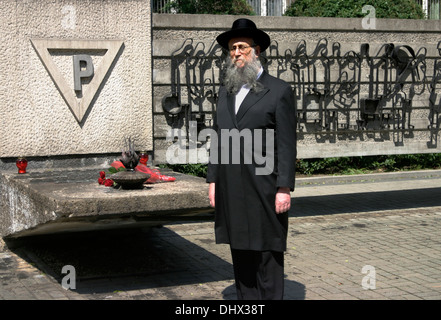 Jewish man standing in front of Tarnow  Jewish Ghetto monument to the First Transport of Jews to Auschwitz Stock Photo