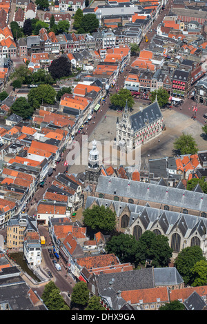 Netherlands, Gouda, Townhall from 15th century on market square. Aerial Stock Photo
