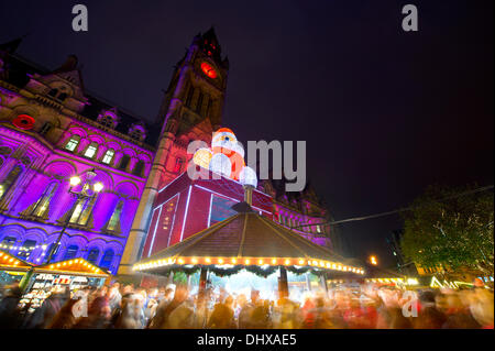 Manchester, UK. 15th November, 2013. Thousands of visitors flock to the 300 Christmas Market stalls spread across various locations in Manchester city centre. This is the 15th year that the Christmas Market has come to town, and is the biggest in Britain. The Markets are located in Corporation Street, King Street and Exchange Square, though the largest is in Albert Square, in front of the town hall. Credit:  Russell Hart/Alamy Live News (Editorial use only). Stock Photo