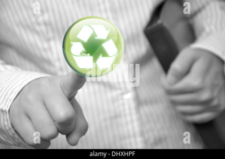 Pressing recycle sign button Stock Photo