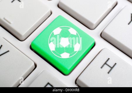 Green football key on keyboard Stock Photo - Alamy