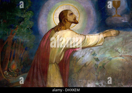 Mural of Jesus praying in the Garden of Gethsemane before the Crucifixion pondering whether he might be freed of this bitter cup Stock Photo