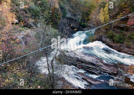 Water surges over and around boulders in the gorge of Tallulah Falls State Park in Rabun County, Georgia. USA Stock Photo