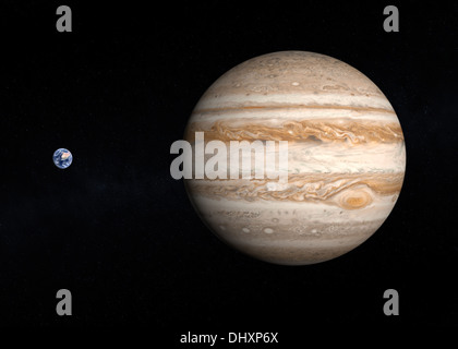 A comparison between the planets Earth and Jupiter on a slightly starry background. Stock Photo