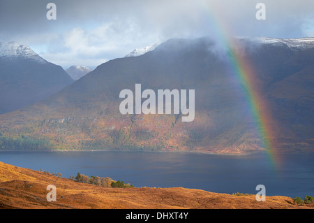 A rainbow over Loch Torridon and Mullach an Rathain in the Scottish Highlands, UK. Stock Photo