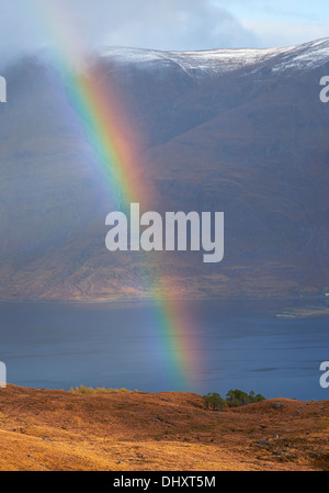 A rainbow over Loch Torridon and Mullach an Rathain in the Scottish Highlands, UK. Stock Photo