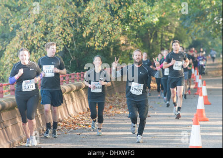 Battersea Park, London, UK. 16th November 2013. Runners race around  Battersea Park as they take part in the Men's Health Survival of the Fittest adventure race. Credit:  Matthew Chattle/Alamy Live News Stock Photo