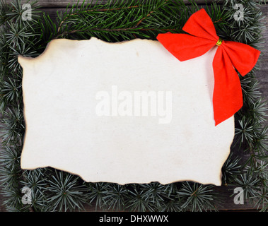 Christmas decoration and vintage paper on wooden background Stock Photo