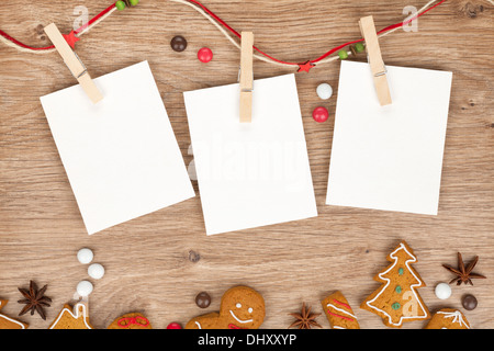 Blank gift tags with pine branch and Christmas cookies on textile