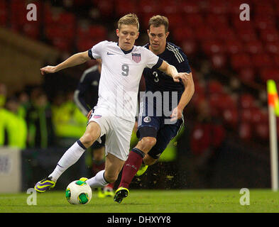 Glasgow, Scotland. 15th Nov, 2013. USA's Aron Johannsson holds off Scotland's Steven Whittaker during the International friendly fixture between Scotland and the USA. From Hampden Stadium, Glasgow. Credit:  Action Plus Sports/Alamy Live News Stock Photo
