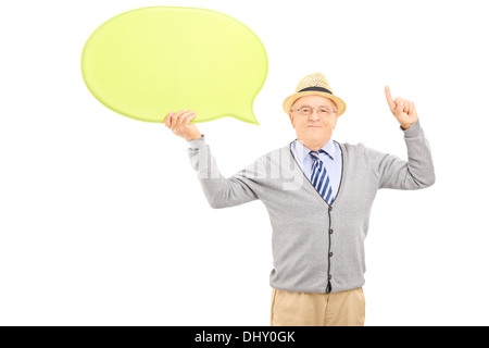 Senior gentleman holding an empty speech bubble and gesturing with his finger Stock Photo