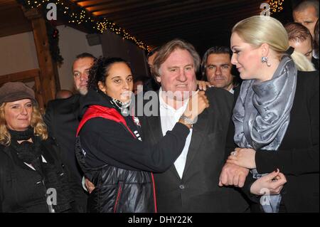 Roxanna (21), daughter of Gerard Depardieu, Gerard Depardieu and Kathrin Glock (left to right), wife of manufacturer Gaston Glock 'Glock' pistols pose at the opening of the traditional Christmas market on Aiderbichl, the animal paradise for homeless animals on 14 November 2013 in the village Henndorf near Salzburg in Austria. Stock Photo