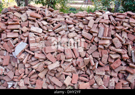old used red clay bricks stack in India Stock Photo