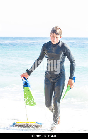 Young Man wearing a wet suit in the Ocean at Malibu California Stock Photo