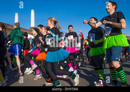 Battersea, London, UK. 16th November 2013. Some teams dressed up for the occasion at the Men's Health Survival of the Fittest 2013 event at Battersea Power Station. Credit:  Paul Davey/Alamy Live News Stock Photo