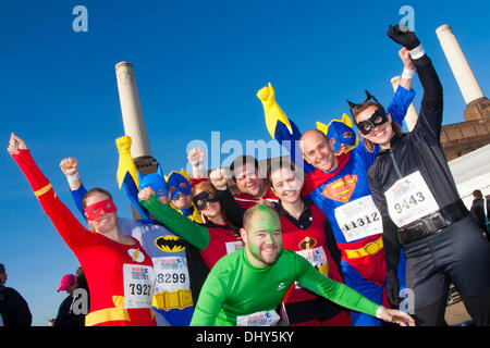 Battersea, London, UK. 16th November 2013. Superheroes pose for the camera at the Men's Health Survival of the Fittest 2013 event at Battersea Power Station. Credit:  Paul Davey/Alamy Live News Stock Photo