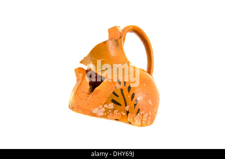 broken ornamental ancient clay jug isolated on white background Stock Photo