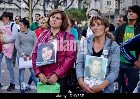 Argentina, Buenos Aires - November 15, 2013: relatives of victims of the so-called 'trigger happy' name given to police violence, manifested in Plaza de Mayo to demand justice for the death of young people killed by police repression. Stock Photo
