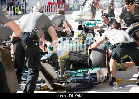 The Mercedes AMG Petronas pit crew of driver Nico Rosberg changes tires during pit action at the second practice session Friday Stock Photo