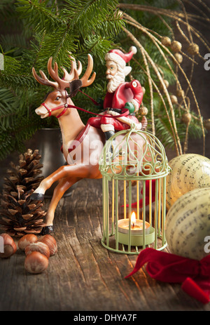 Christmas Decoration with Santa Claus and Candle Stock Photo