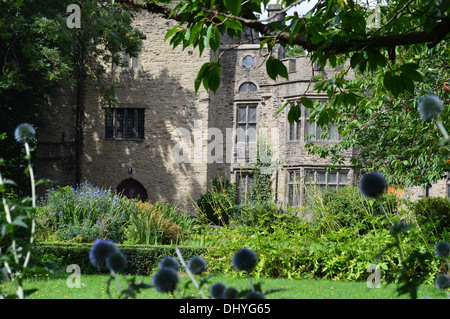 Bolling Hall Bradford from the Gardens looking through thistles the hall is reputed to be haunted by Anne Boleyn Stock Photo