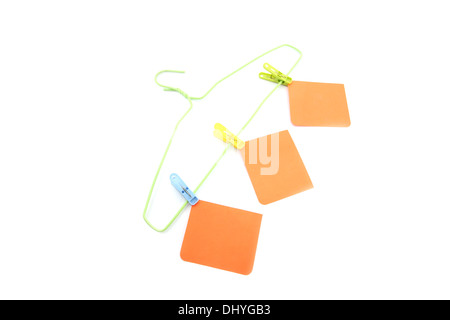 The Note paper and hanger on the white background. Stock Photo